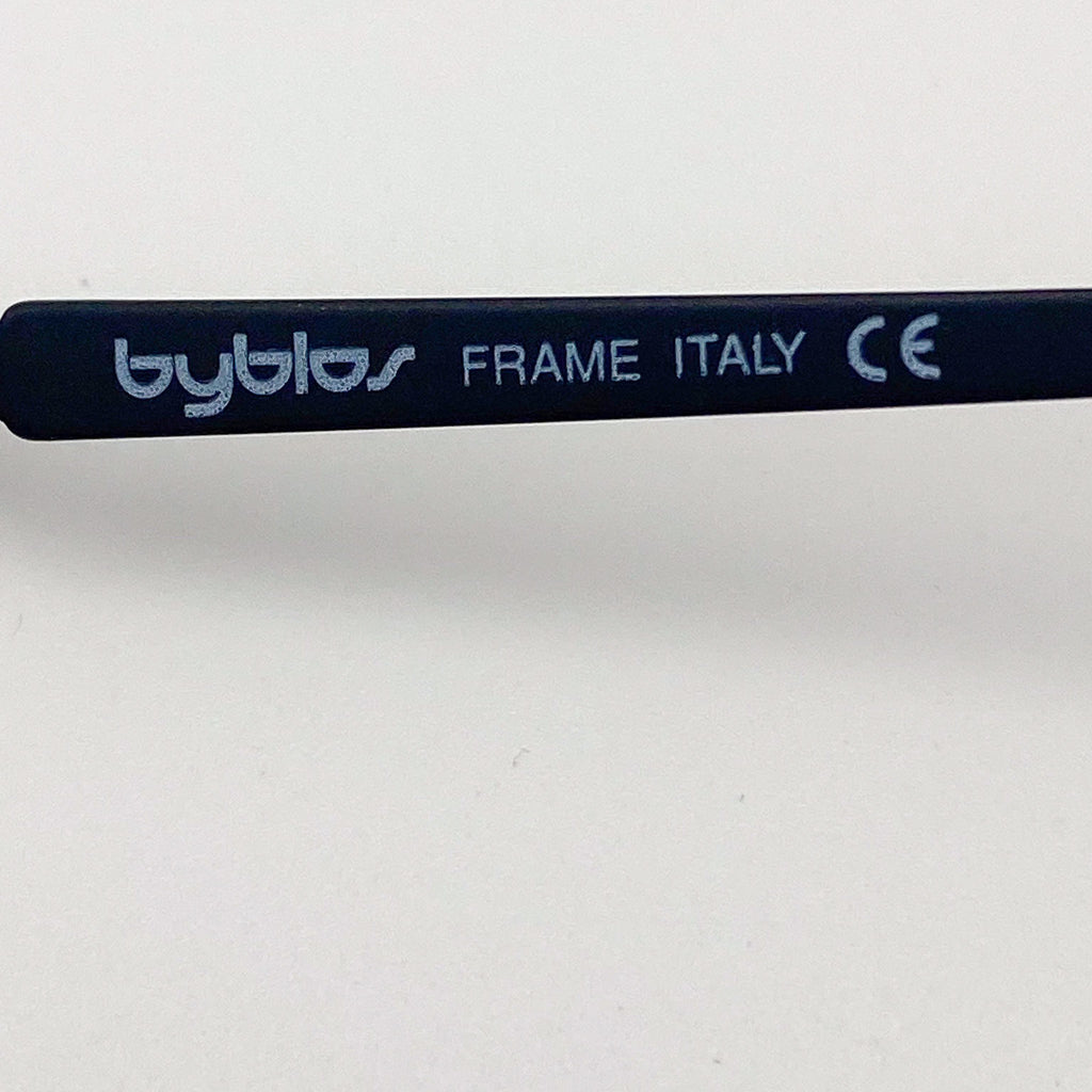 Eyeglass frame with 'byblos' branding and 'FRAME ITALY' text on a white background