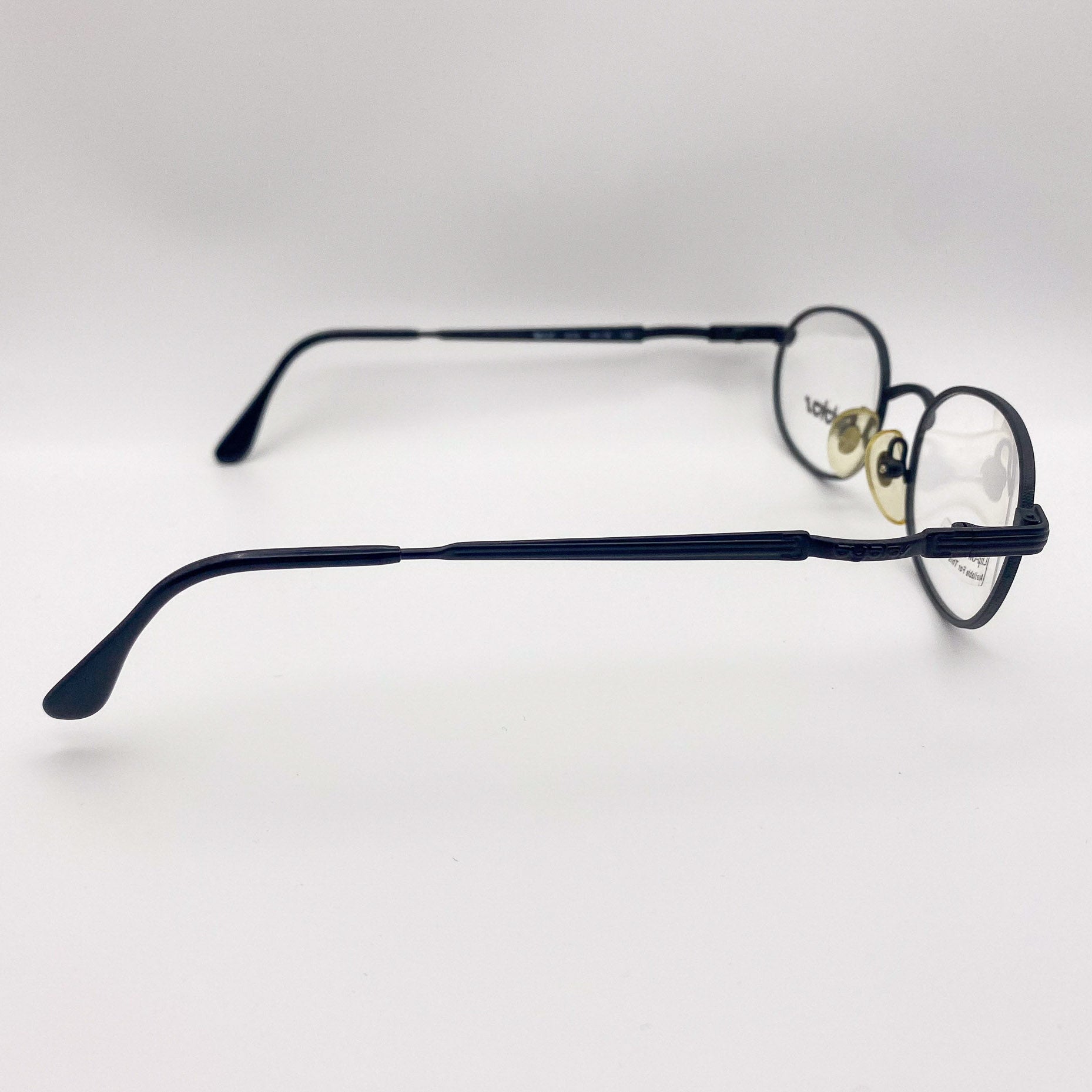 Black 90s eyeglasses on a white background
