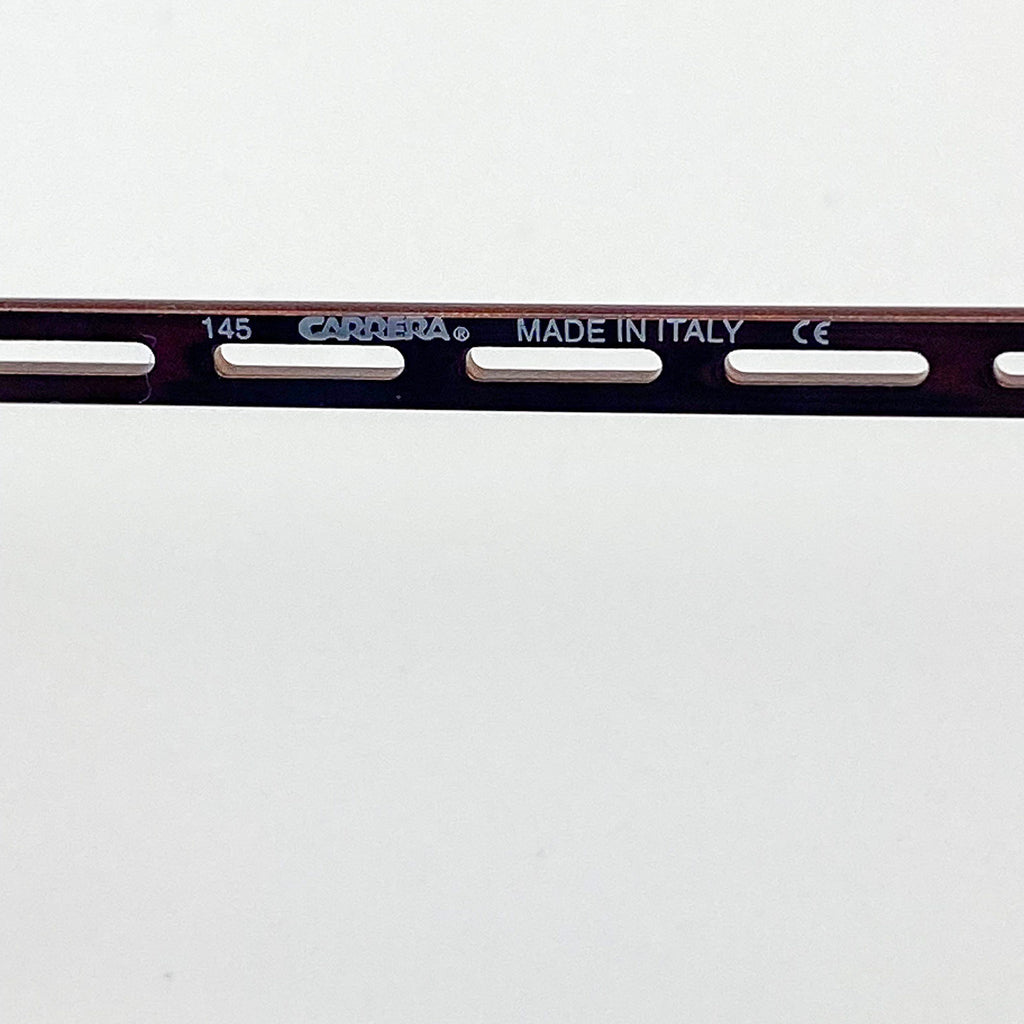 Carrera eyeglass frame bar with brand name and 'Made in Italy' text on a white background