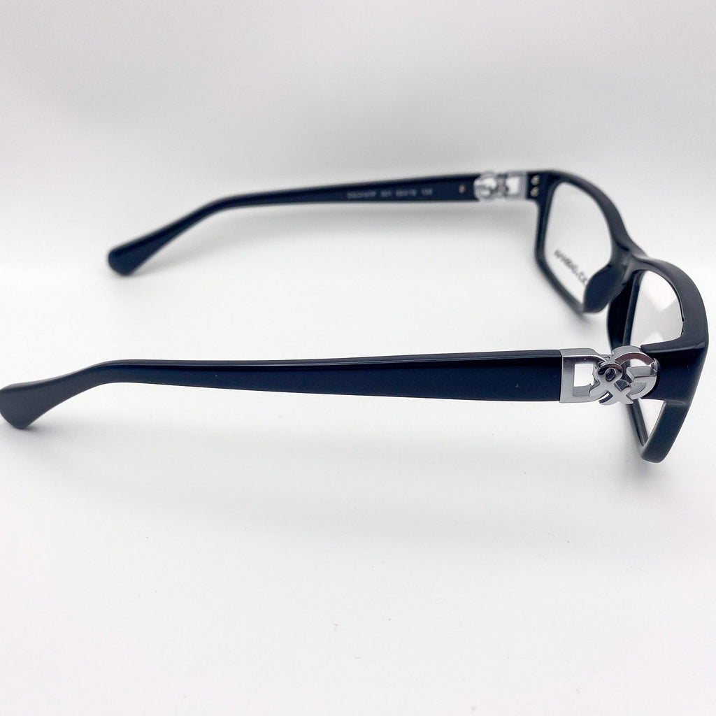 Black eyeglasses with silver accents on a white background