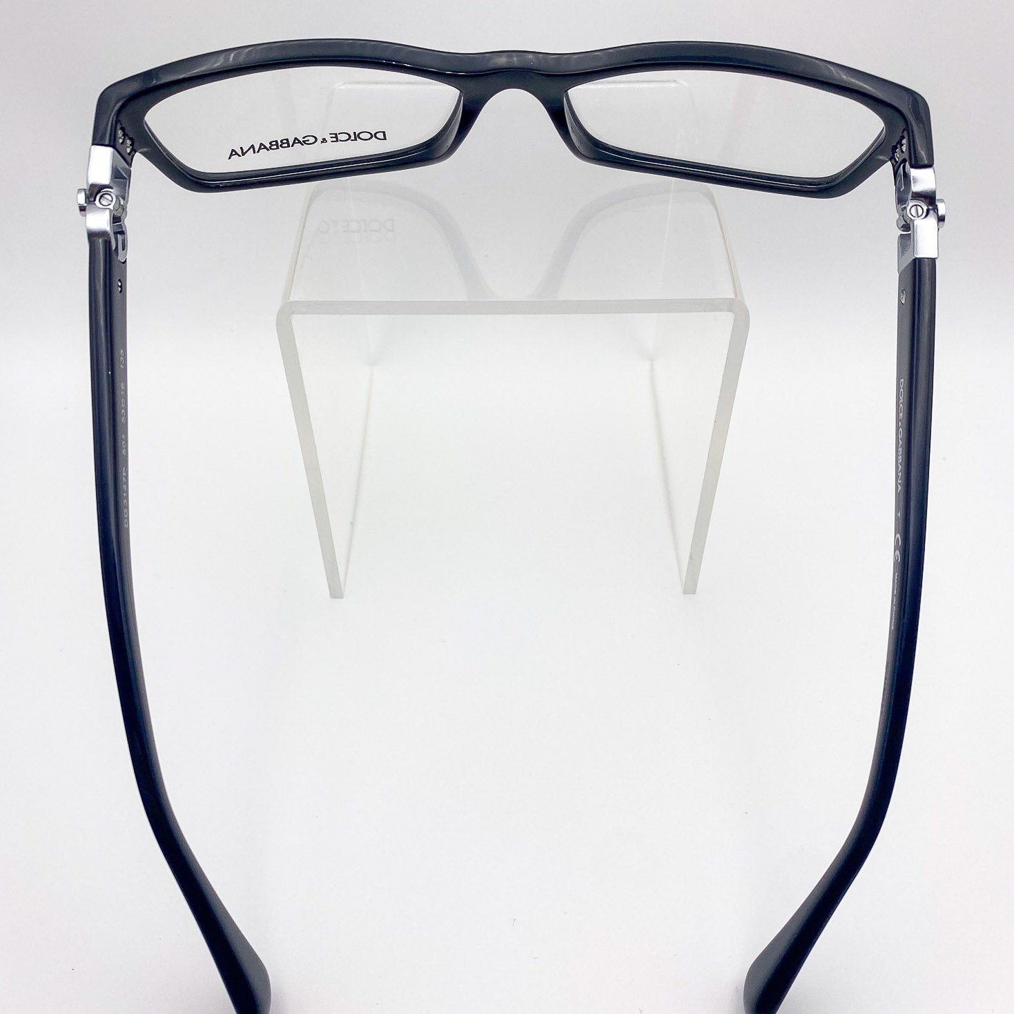 Black glasses with silver accents on a white background