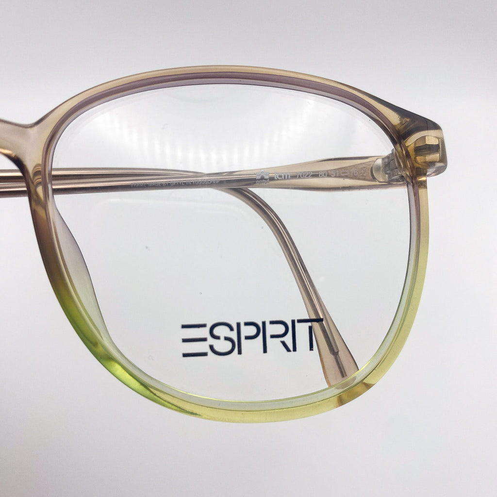 Close-up of a pair of glasses with 'Esprit' logo on a light gray background