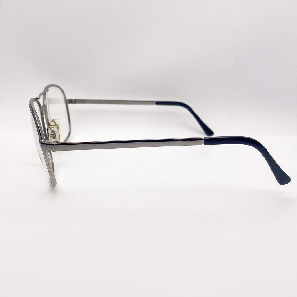 Eyeglasses with a silver frame and black arms on a white background