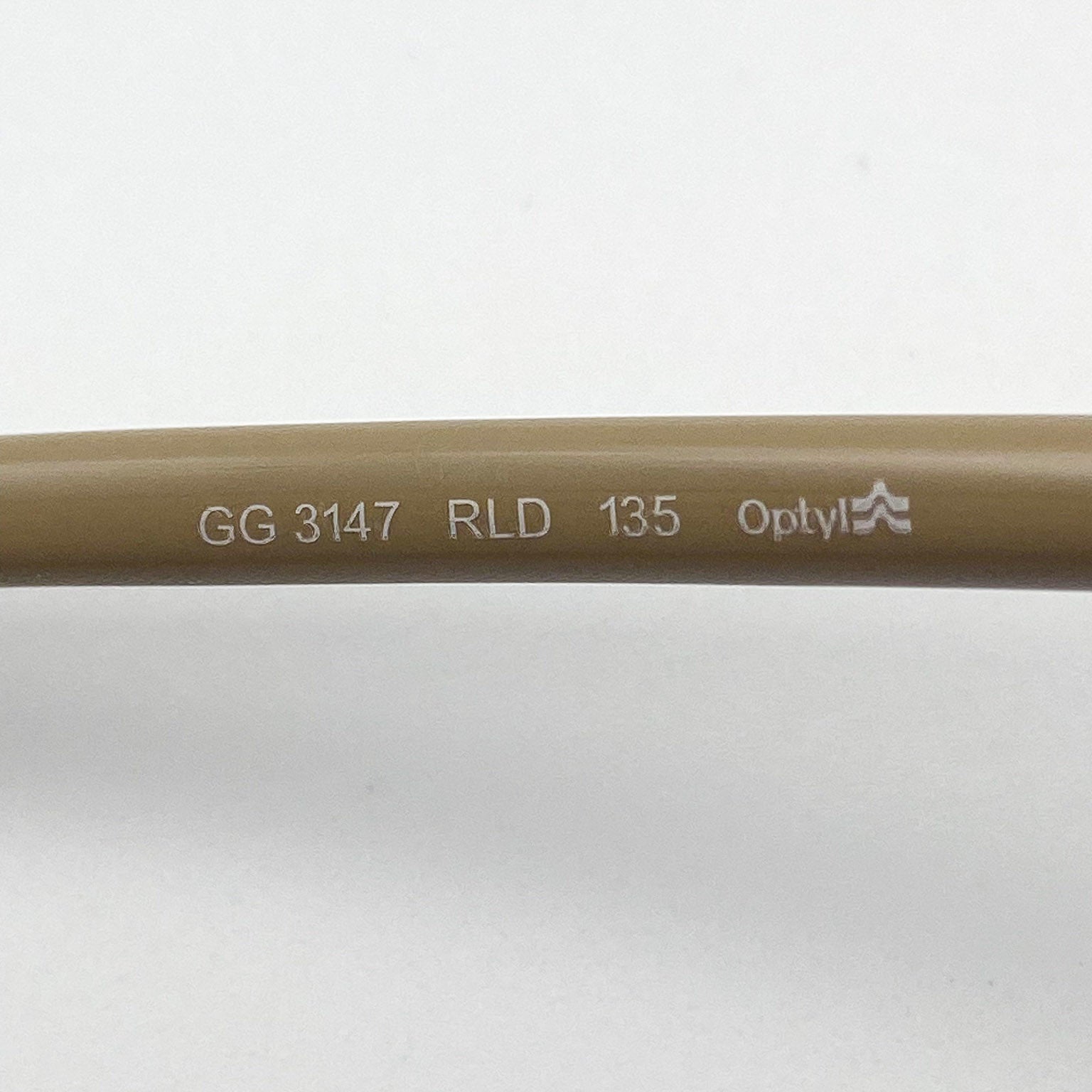 Brown temple stem with text and Optyl logo on a white background