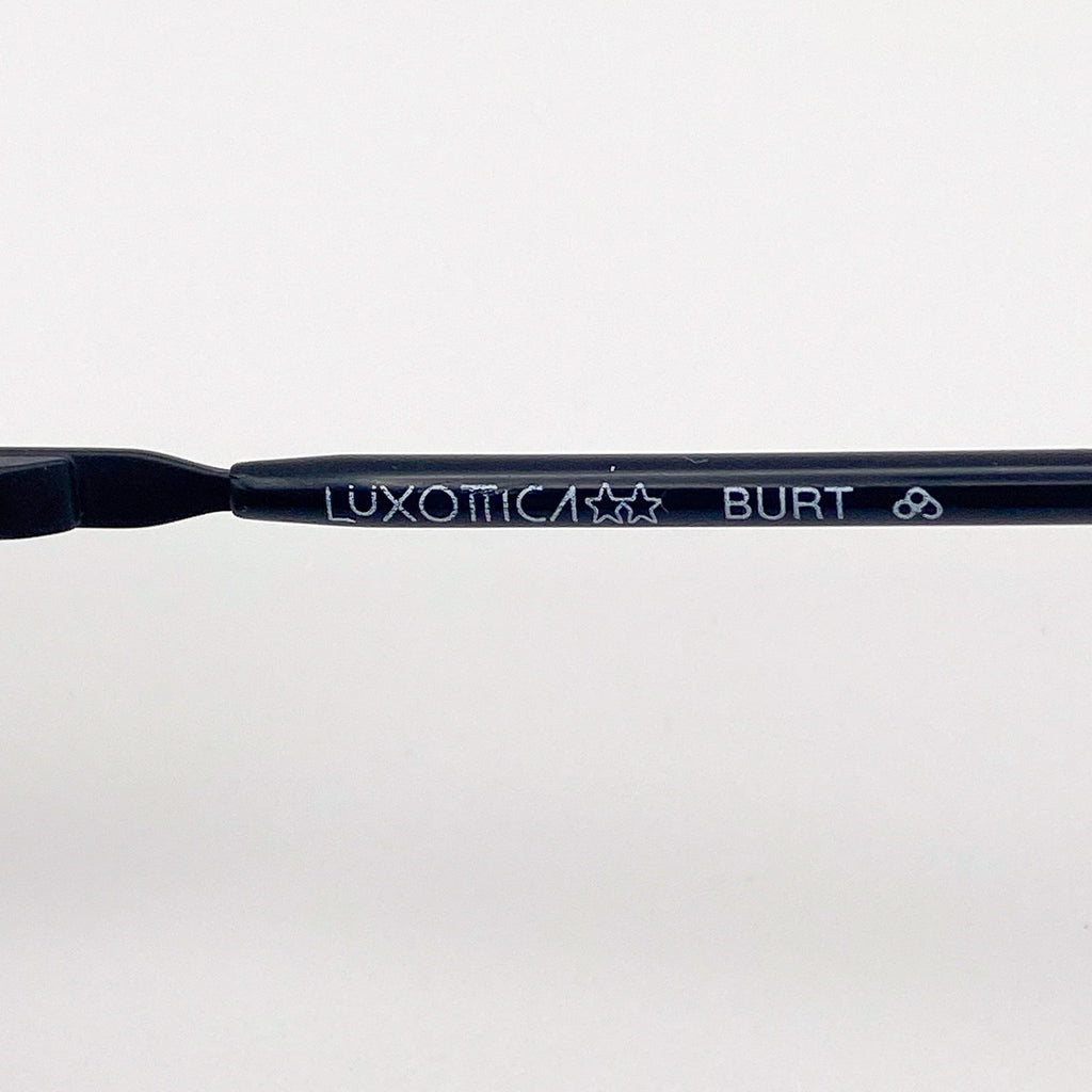 Eyeglass frame with 'Luxottica Burt' branding on a white background