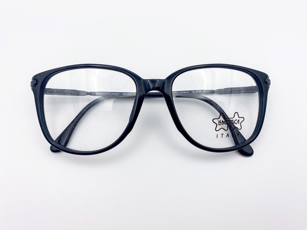 Oversized vintage black eyeglasses frames on a white background