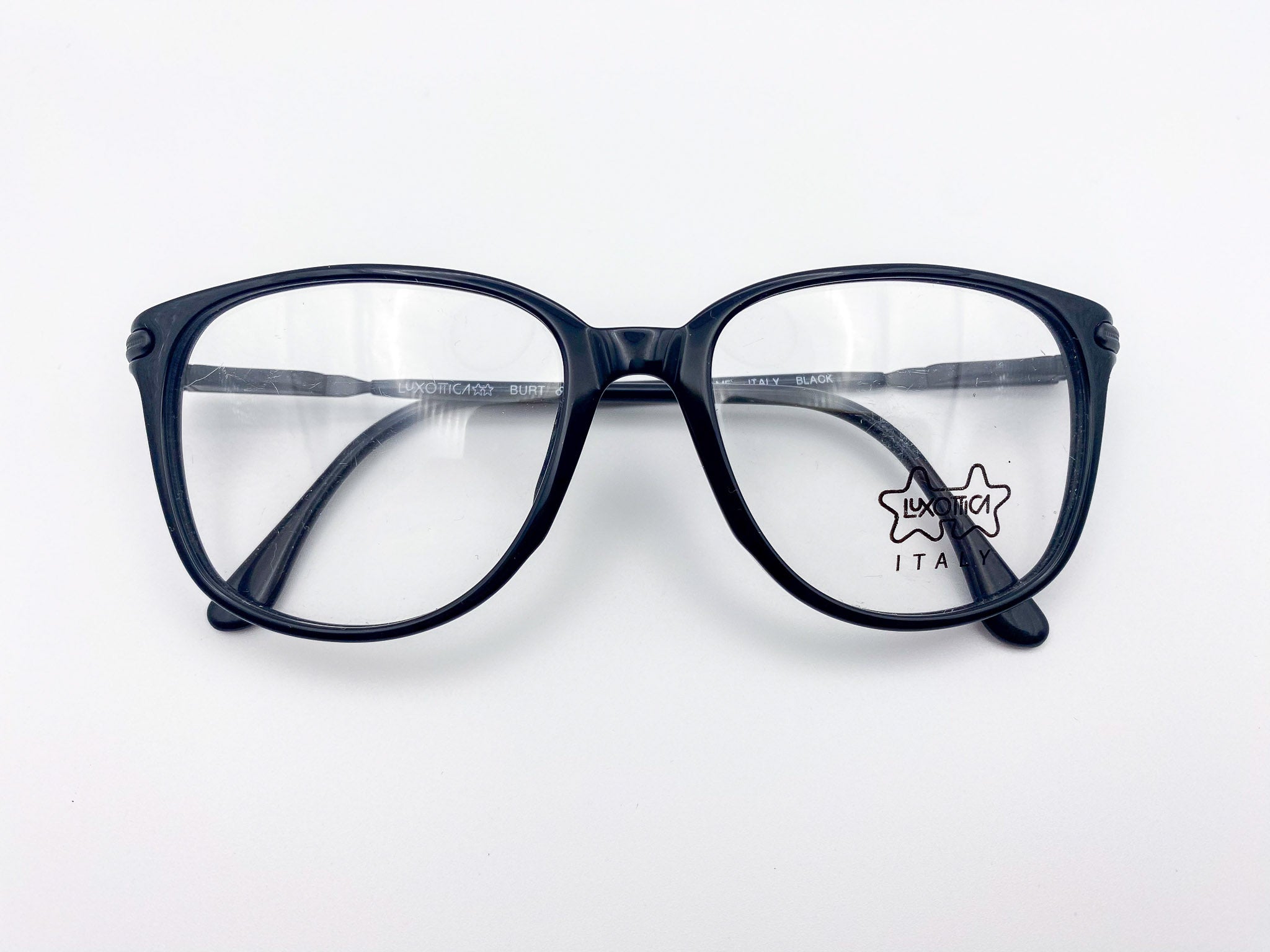 Oversized vintage black eyeglasses frames on a white background