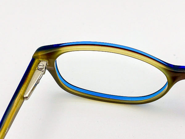 Y2K eyeglasses with blue and olive green frame on a white background