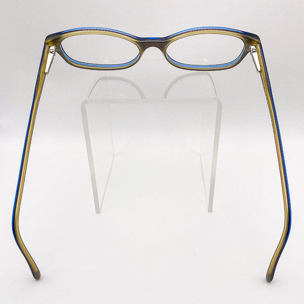 Eyeglasses with blue and gold frame on a white background