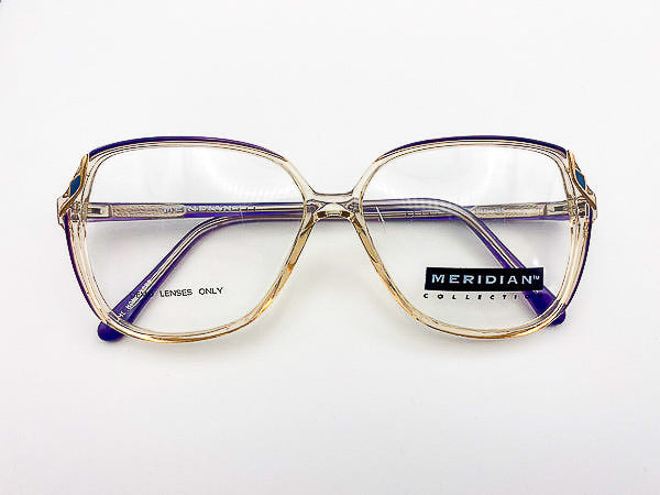 Vintage eyeglasses with 'Meridian Collection' label on a white background