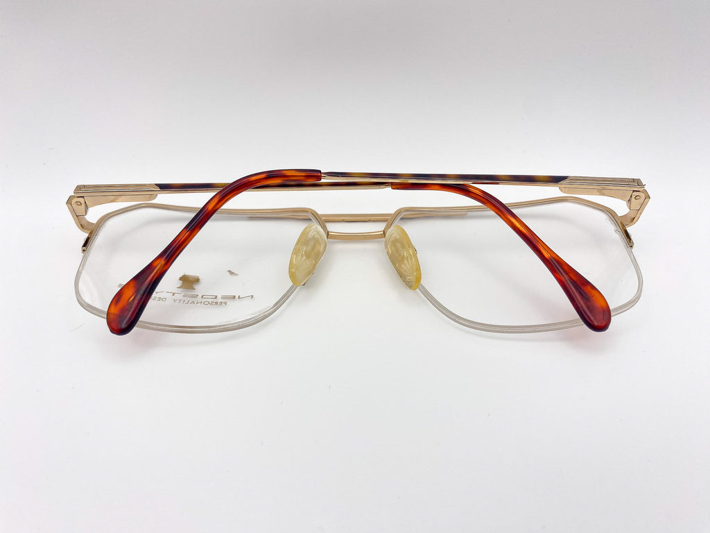 1980s eyeglasses with tortoiseshell frame on a white background