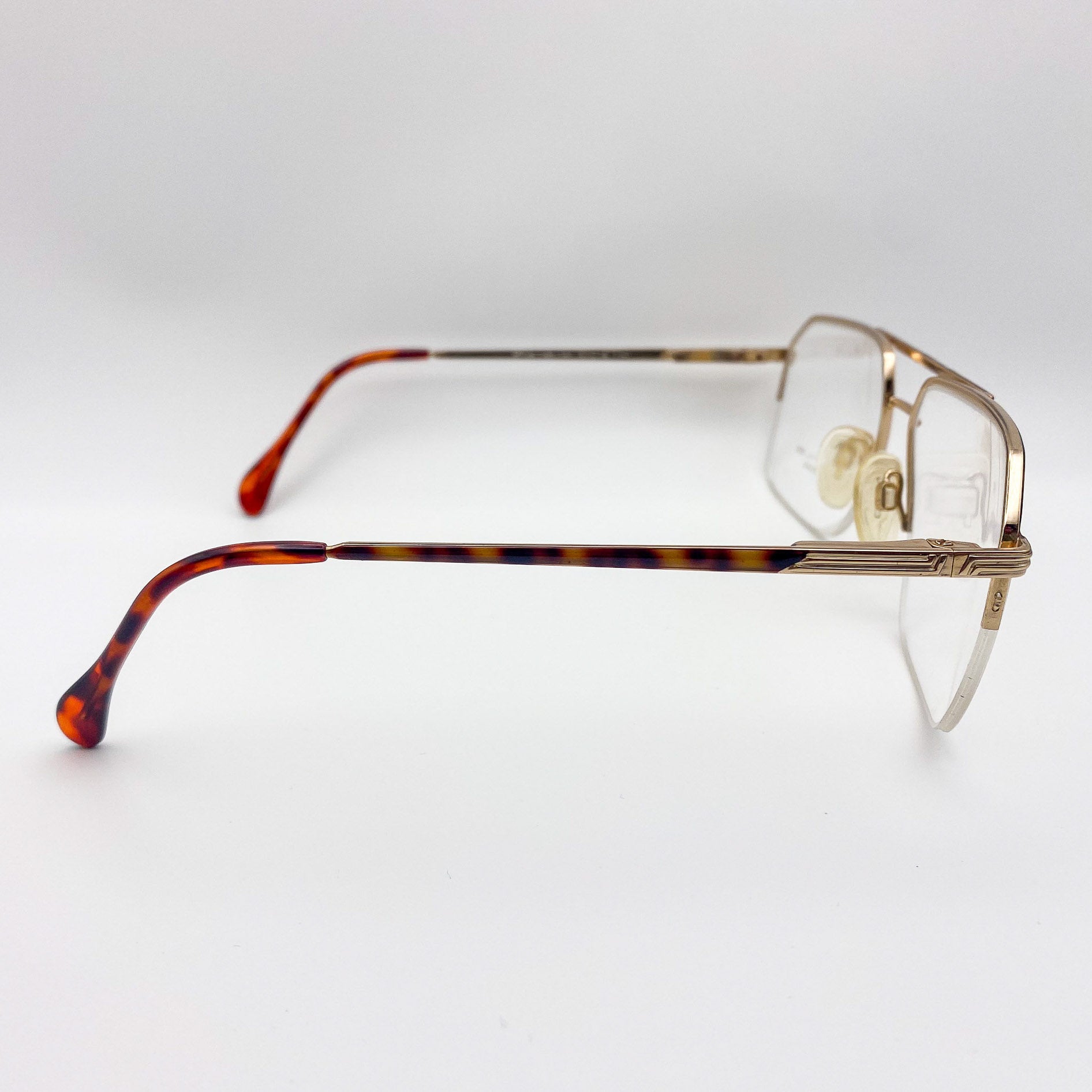 1980s eyeglasses with tortoiseshell arms on a white background