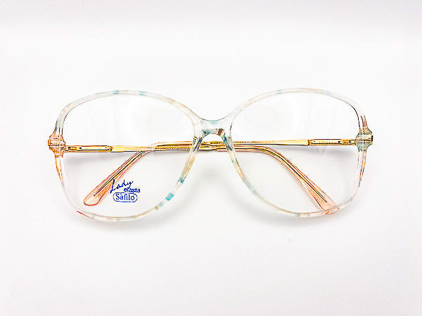 Vintage oversized eyeglasses with gold frame and clear lenses on a white background
