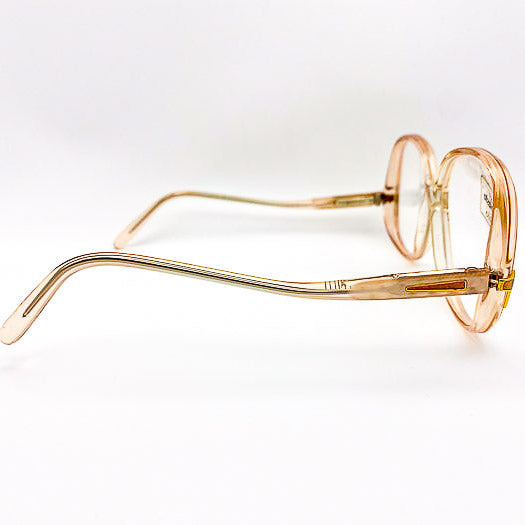 Gold-framed eyeglasses on a white background