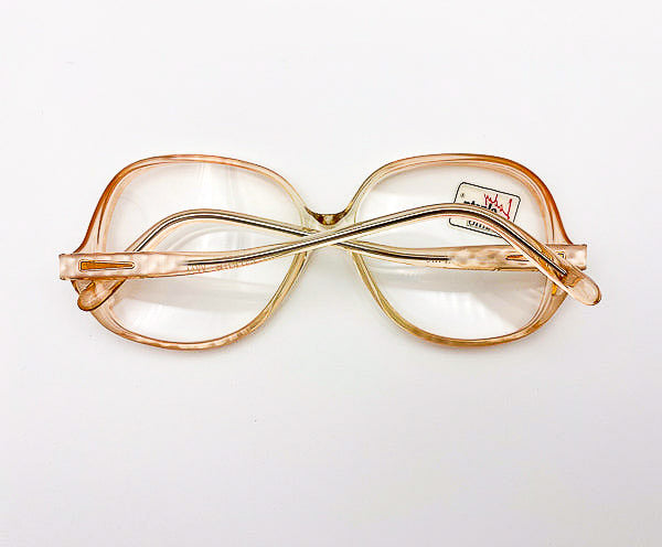 1980s peach grandma glasses with a clear lens on a white background