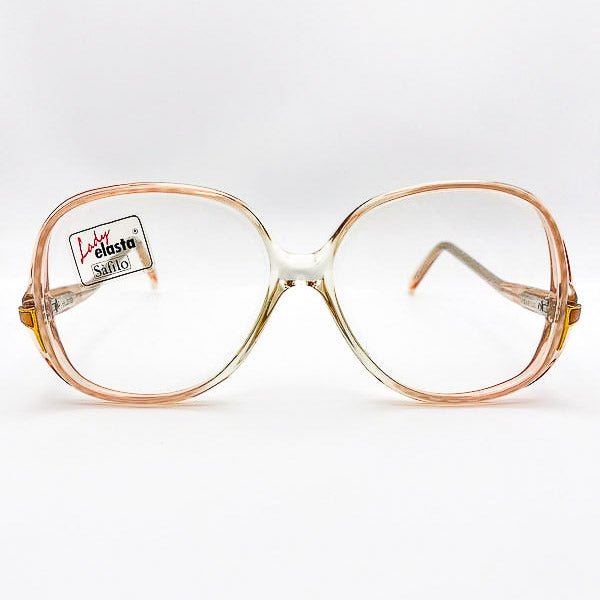 Vintage drop-arm eyeglasses with a clear frame on a white background