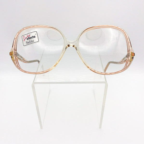 80s oversized peach eyeglasses with a clear lens on a white background