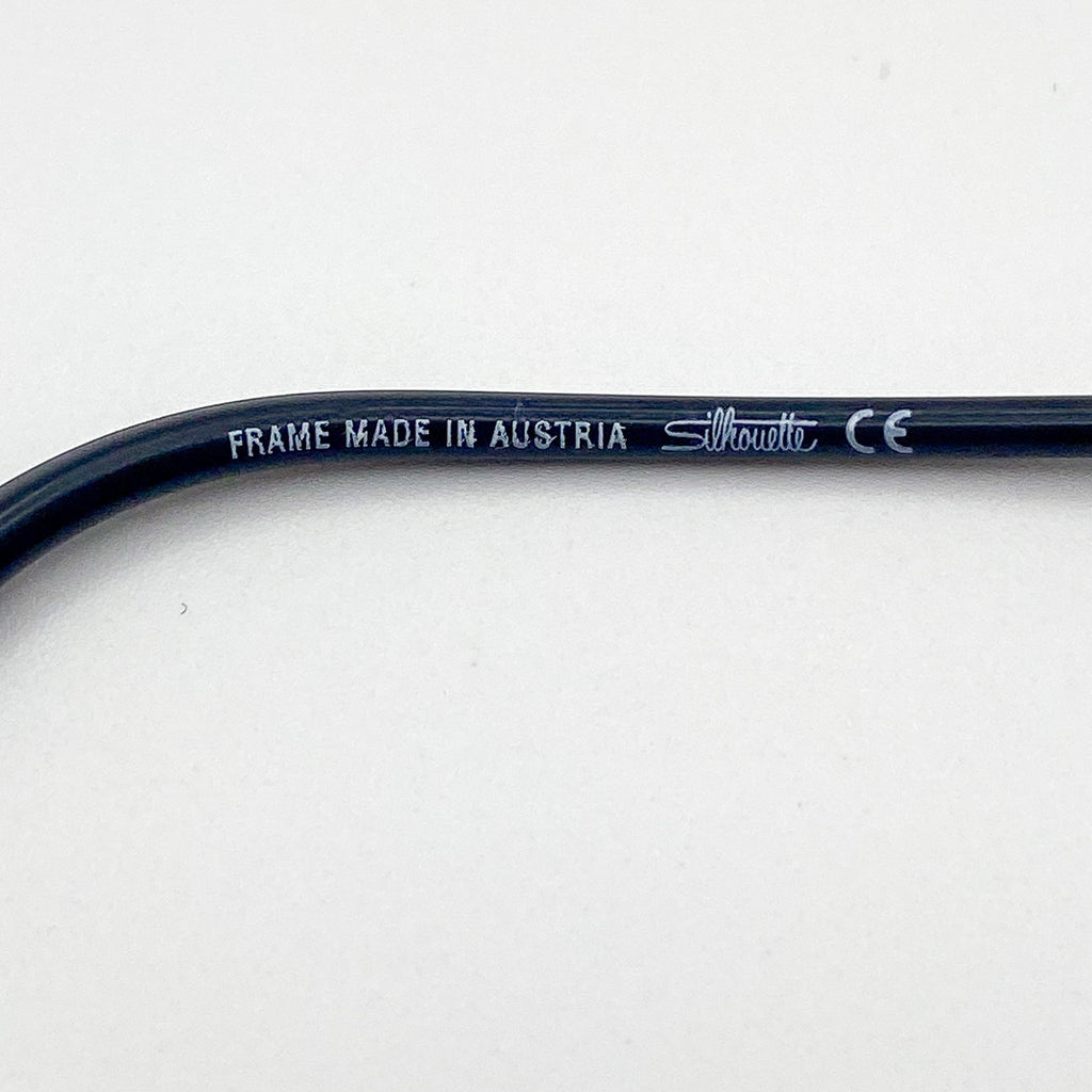 Eyeglass frame with 'Made in Austria' and 'Silhouette' branding on a white background