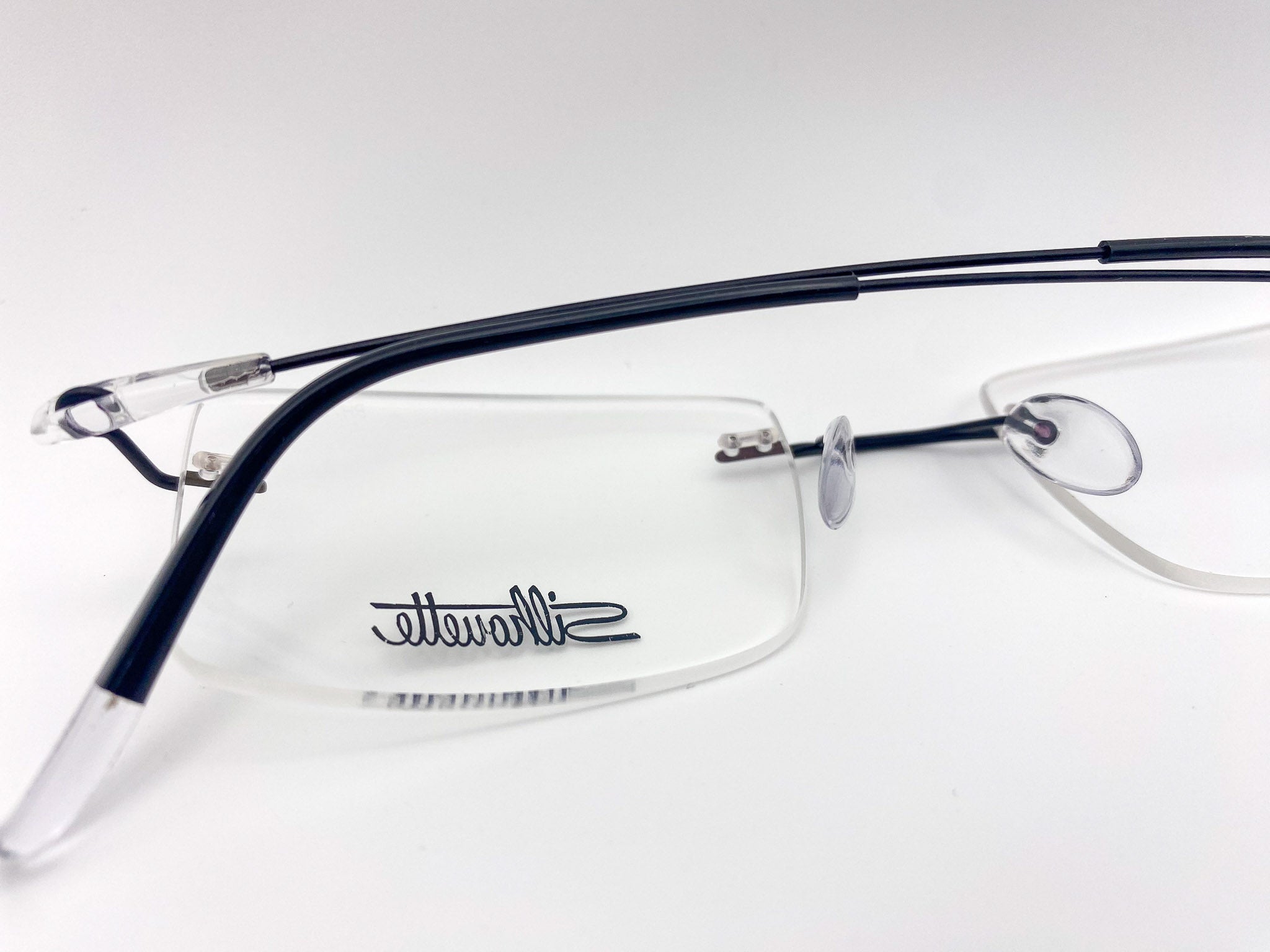 Eyeglasses with 'Silhouette' logo on a white background