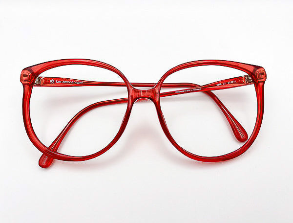 Vintage Terri Brogan translucent red 
eyeglasses on a white background