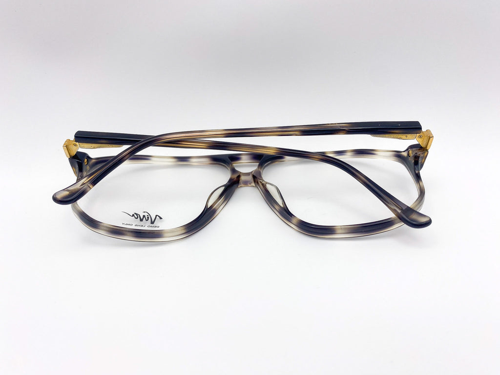 1980s eyeglasses with a tortoiseshell frame on a white background