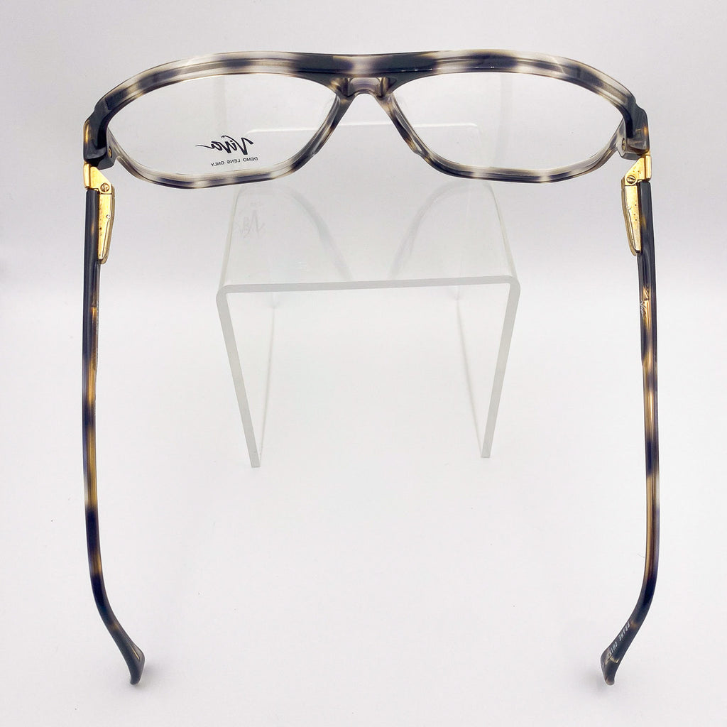 Eyeglasses with tortoiseshell frame and gold accents on a white background